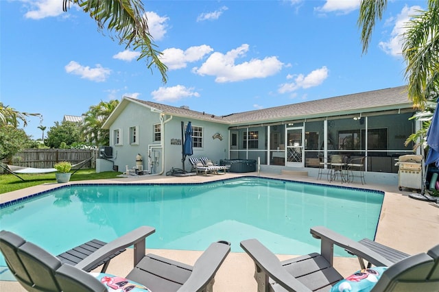 338 7th Ave N, Tierra Verde, FL 33715 - view of swimming pool with a sunroom, a patio, and area for grilling