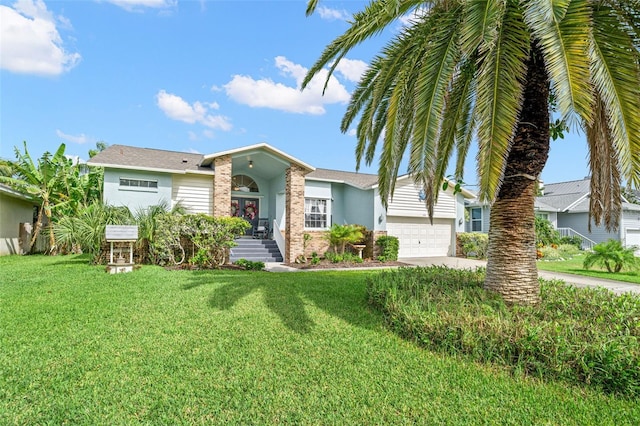 338 7th Ave N, Tierra Verde, FL 33715 - view of front of home with a front lawn, an attached garage, concrete driveway, french doors, and stucco siding
