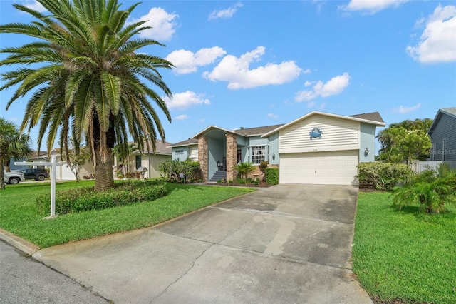 338 7th Ave N, Tierra Verde, FL 33715 - view of front of property featuring driveway, a front yard, and a garage