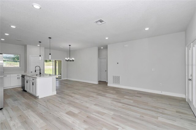 2705 W Royal Palm Dr, Citrus Springs, FL 34434 - kitchen featuring dishwasher, light countertops, recessed lighting, a chandelier, and white cabinetry