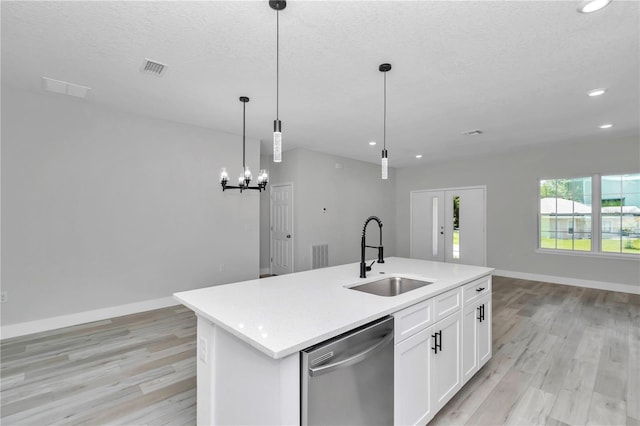2705 W Royal Palm Dr, Citrus Springs, FL 34434 - kitchen featuring stainless steel dishwasher, open floor plan, light wood finished floors, recessed lighting, and a kitchen island with sink