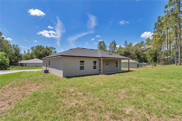 2705 W Royal Palm Dr, Citrus Springs, FL 34434 - rear view of property featuring stucco siding