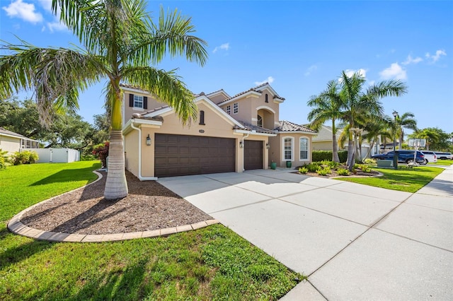 1178 Fraser Pine Blvd, Sarasota, FL 34240 - mediterranean / spanish home with stucco siding, an attached garage, and concrete driveway