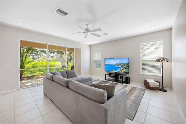 1178 Fraser Pine Blvd, Sarasota, FL 34240 - living area with light tile patterned floors, baseboards, and ceiling fan