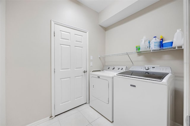 1178 Fraser Pine Blvd, Sarasota, FL 34240 - laundry room featuring washing machine and clothes dryer and light tile patterned floors