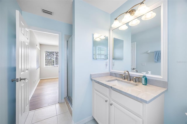 1178 Fraser Pine Blvd, Sarasota, FL 34240 - bathroom with vanity, tile patterned flooring, a shower with shower door, and baseboards