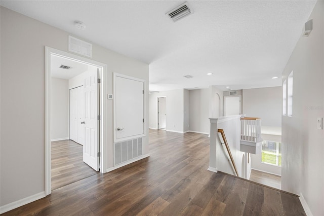 1178 Fraser Pine Blvd, Sarasota, FL 34240 - corridor featuring an upstairs landing, dark wood-style flooring, baseboards, and recessed lighting