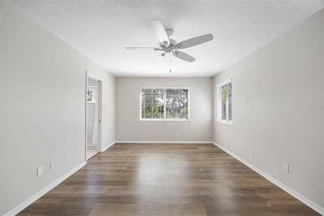 1178 Fraser Pine Blvd, Sarasota, FL 34240 - empty room with ceiling fan, wood finished floors, a textured ceiling, and baseboards