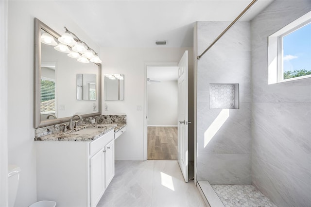 1178 Fraser Pine Blvd, Sarasota, FL 34240 - full bathroom featuring vanity, a tile shower, toilet, and baseboards