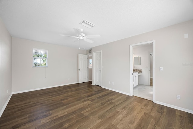 1178 Fraser Pine Blvd, Sarasota, FL 34240 - unfurnished bedroom featuring wood finished floors, baseboards, ensuite bath, and ceiling fan