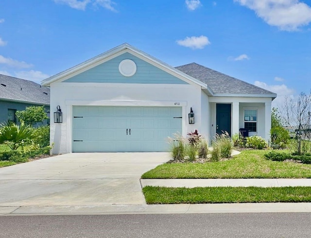 4510 Big Woods Way, Parrish, FL 34219 - ranch-style house with an attached garage, driveway, stucco siding, and roof with shingles