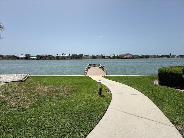 750 Island Way Unit 101, Clearwater Beach, FL 33767 - dock area featuring a water view and a lawn