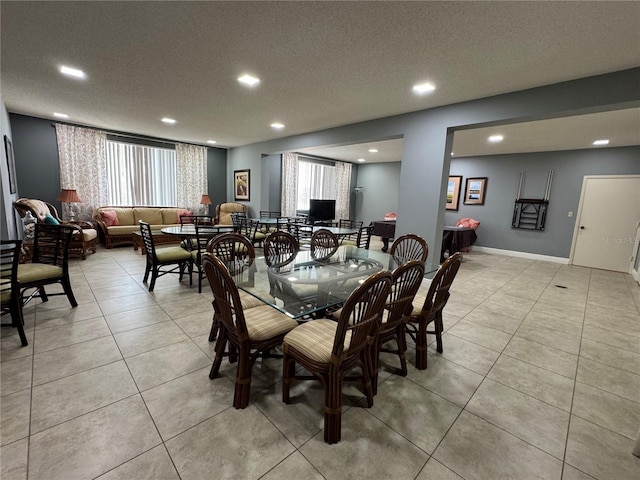 750 Island Way Unit 101, Clearwater Beach, FL 33767 - dining room featuring recessed lighting, light tile patterned floors, and a textured ceiling