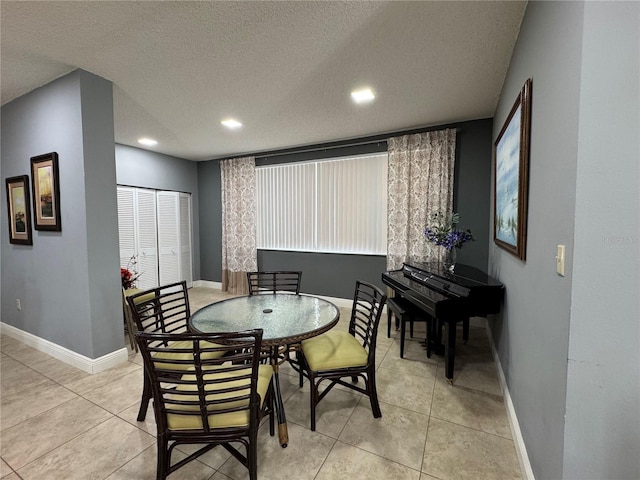 750 Island Way Unit 101, Clearwater Beach, FL 33767 - dining room with baseboards, a textured ceiling, light tile patterned flooring, and recessed lighting