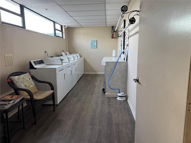750 Island Way Unit 101, Clearwater Beach, FL 33767 - laundry room featuring washer and dryer, dark wood-type flooring, and baseboards