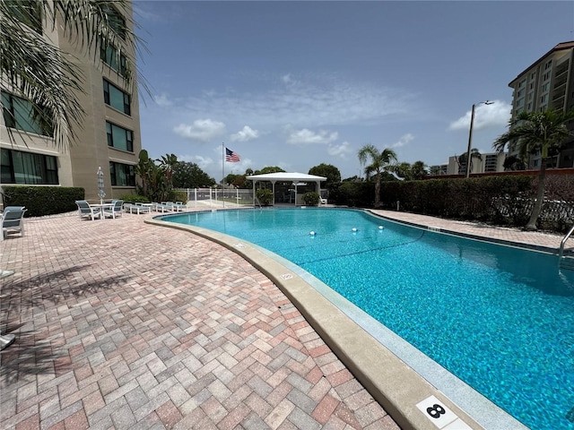 750 Island Way Unit 101, Clearwater Beach, FL 33767 - community pool with a patio area