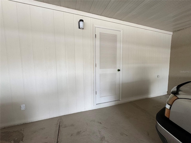 750 Island Way Unit 101, Clearwater Beach, FL 33767 - interior space with concrete flooring and wood walls