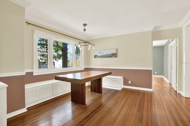 258 14th Ave NE, Saint Petersburg, FL 33701 - unfurnished dining area featuring dark wood-type flooring and ornamental molding