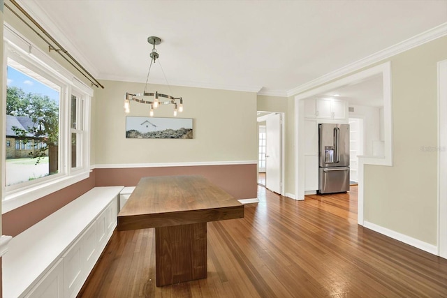 258 14th Ave NE, Saint Petersburg, FL 33701 - unfurnished dining area featuring a chandelier, dark wood-style flooring, and ornamental molding