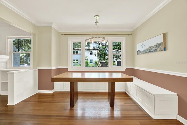 258 14th Ave NE, Saint Petersburg, FL 33701 - unfurnished dining area with healthy amount of natural light, dark wood-type flooring, ornamental molding, and a chandelier