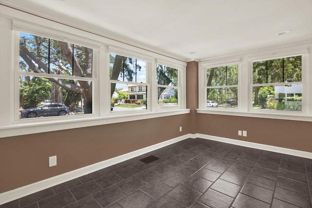 258 14th Ave NE, Saint Petersburg, FL 33701 - unfurnished sunroom featuring baseboards