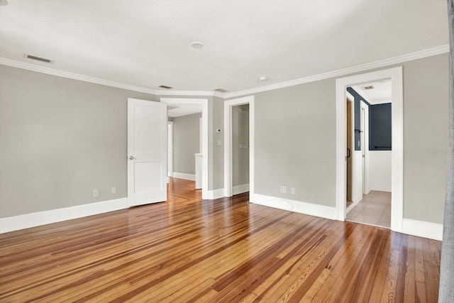 258 14th Ave NE, Saint Petersburg, FL 33701 - unfurnished room with crown molding and light wood finished floors
