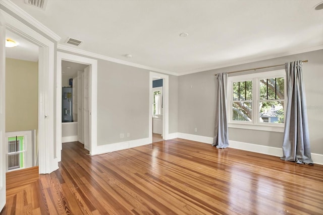 258 14th Ave NE, Saint Petersburg, FL 33701 - unfurnished room with wood finished floors and crown molding