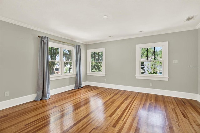 258 14th Ave NE, Saint Petersburg, FL 33701 - unfurnished room with plenty of natural light, hardwood / wood-style flooring, and ornamental molding