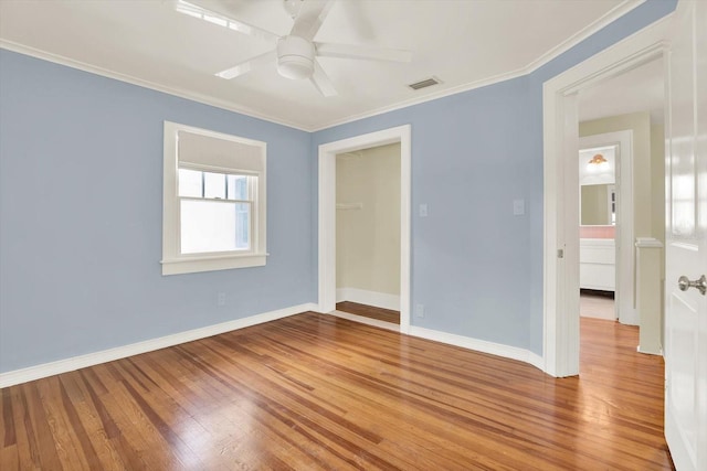 258 14th Ave NE, Saint Petersburg, FL 33701 - empty room with a ceiling fan, crown molding, and wood finished floors