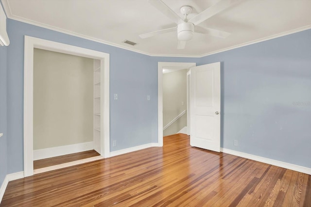 258 14th Ave NE, Saint Petersburg, FL 33701 - empty room with wood finished floors, ceiling fan, and ornamental molding
