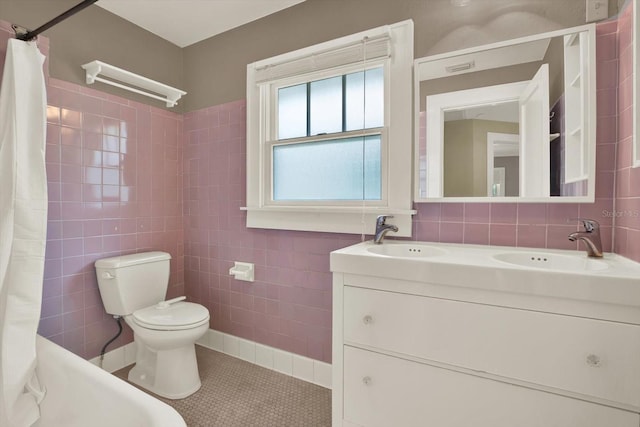 258 14th Ave NE, Saint Petersburg, FL 33701 - bathroom featuring tile walls, tile patterned floors, double vanity, and a shower with shower curtain