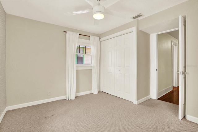 258 14th Ave NE, Saint Petersburg, FL 33701 - unfurnished bedroom with carpet floors, a closet, and ceiling fan
