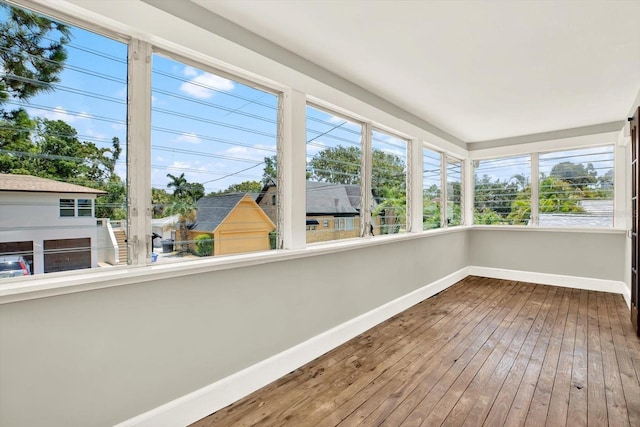 258 14th Ave NE, Saint Petersburg, FL 33701 - unfurnished sunroom featuring wood-type flooring and plenty of natural light