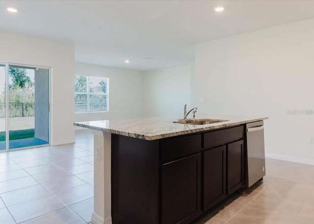 8210 Juning Cv, Wesley Chapel, FL 33545 - kitchen featuring dishwasher, light stone counters, recessed lighting, an island with sink, and light tile patterned flooring