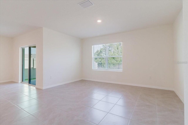 8210 Juning Cv, Wesley Chapel, FL 33545 - empty room featuring light tile patterned floors and recessed lighting