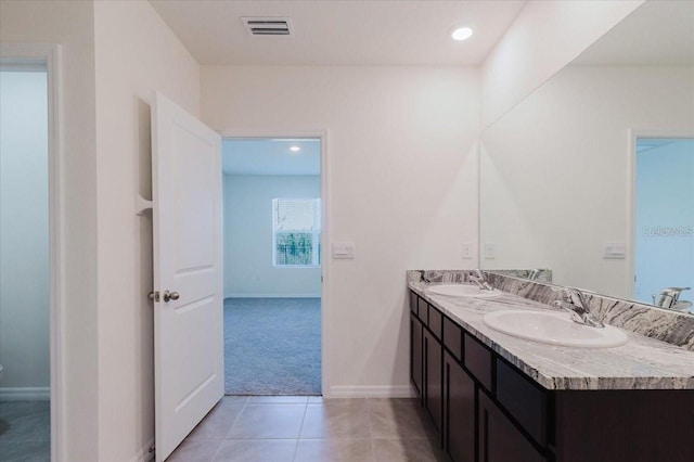 8210 Juning Cv, Wesley Chapel, FL 33545 - full bath with double vanity, tile patterned flooring, and recessed lighting