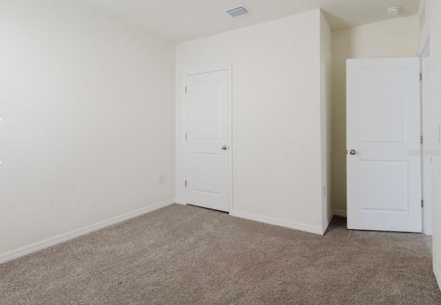 8210 Juning Cv, Wesley Chapel, FL 33545 - unfurnished bedroom with carpet flooring