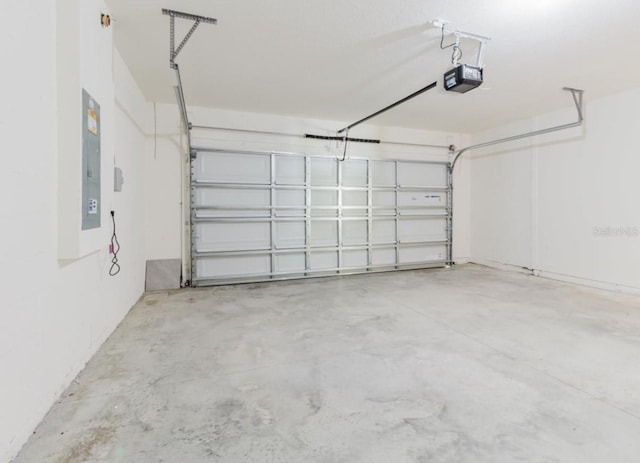 8210 Juning Cv, Wesley Chapel, FL 33545 - garage with a garage door opener and electric panel
