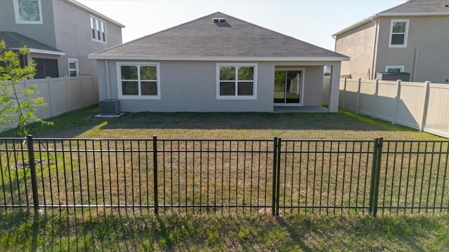 8210 Juning Cv, Wesley Chapel, FL 33545 - back of property featuring a shingled roof, stucco siding, and a fenced backyard