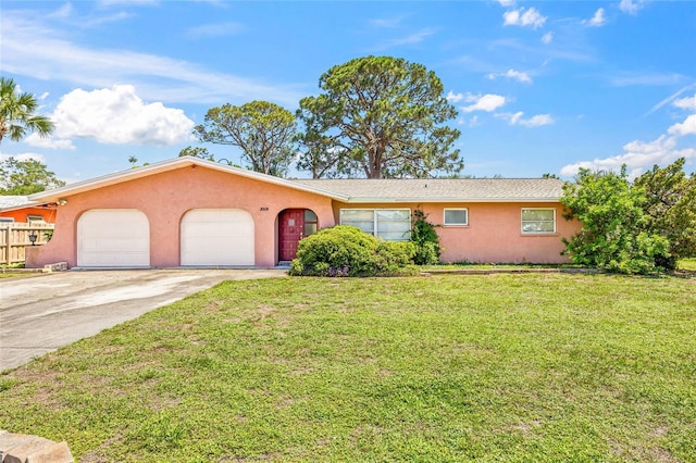 358 Suwanee Ave, Sarasota, FL 34243 - ranch-style house featuring stucco siding, an attached garage, concrete driveway, and a front yard