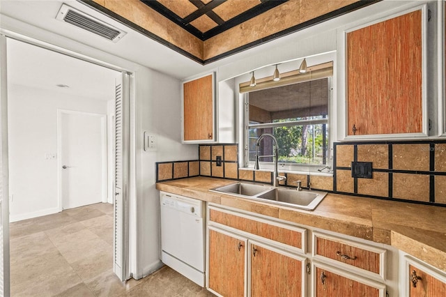 358 Suwanee Ave, Sarasota, FL 34243 - kitchen with dishwasher, decorative backsplash, and light countertops