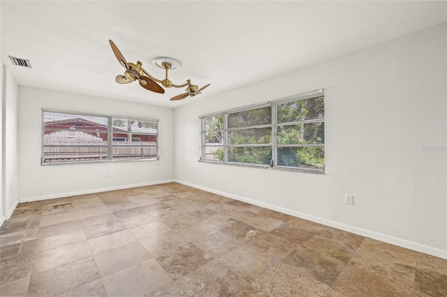 358 Suwanee Ave, Sarasota, FL 34243 - unfurnished room featuring baseboards and a chandelier
