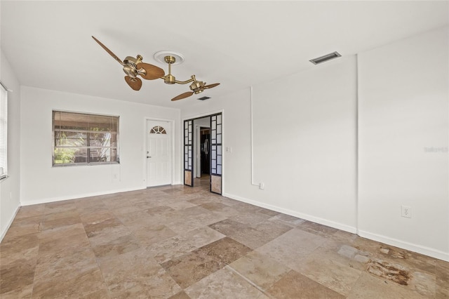 358 Suwanee Ave, Sarasota, FL 34243 - unfurnished room with stone finish floors and ceiling fan