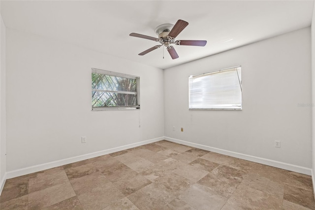 358 Suwanee Ave, Sarasota, FL 34243 - empty room with stone finish flooring and a ceiling fan