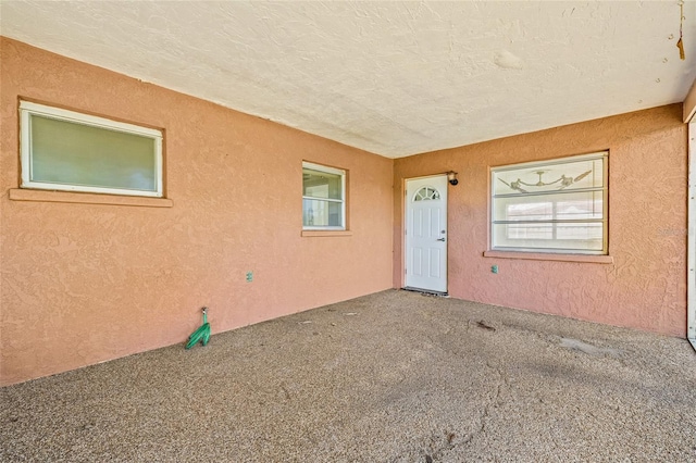 358 Suwanee Ave, Sarasota, FL 34243 - property entrance with stucco siding and a patio