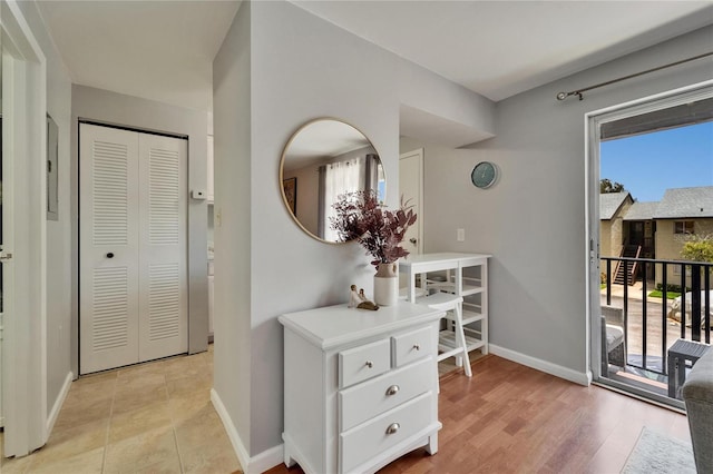 4215 E Bay Dr Unit 1801E, Clearwater, FL 33764 - corridor featuring baseboards and light wood-style floors