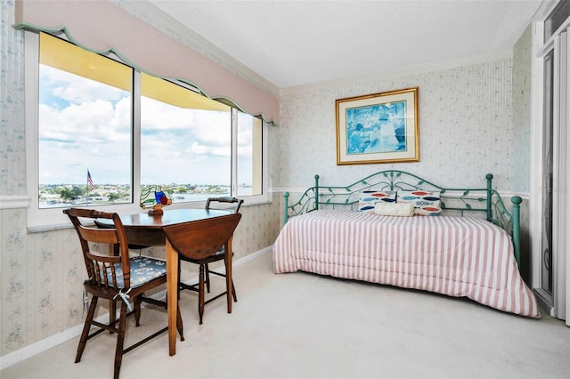 100 Bluff View Dr Unit 511C, Belleair Bluffs, FL 33770 - bedroom with wallpapered walls and crown molding