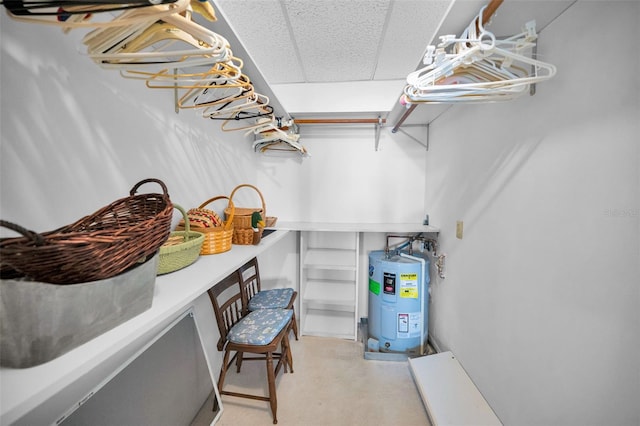 100 Bluff View Dr Unit 511C, Belleair Bluffs, FL 33770 - walk in closet featuring electric water heater and a paneled ceiling