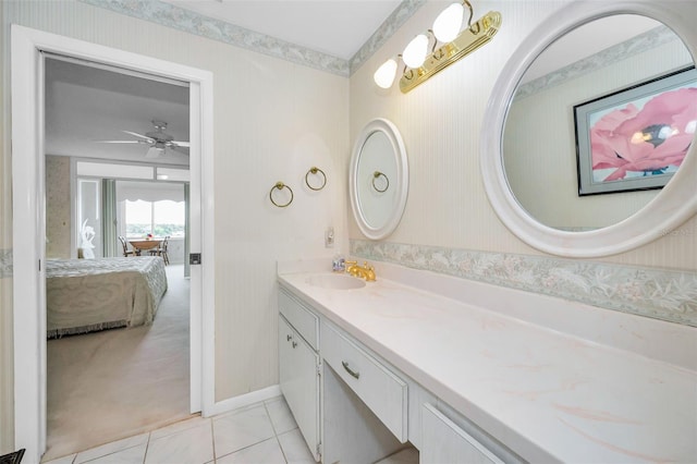 100 Bluff View Dr Unit 511C, Belleair Bluffs, FL 33770 - full bathroom featuring double vanity, connected bathroom, tile patterned flooring, wallpapered walls, and ceiling fan