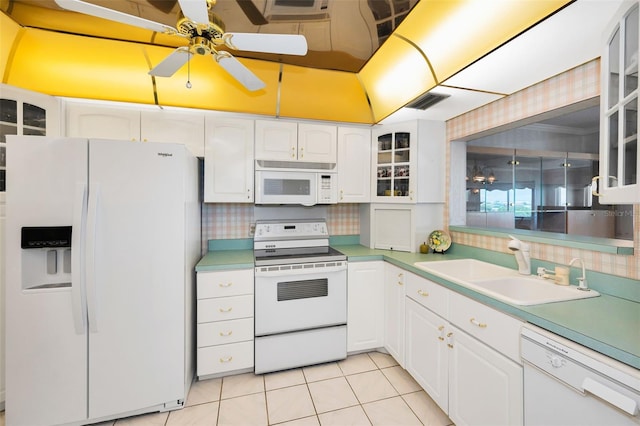 100 Bluff View Dr Unit 511C, Belleair Bluffs, FL 33770 - kitchen with white appliances, tasteful backsplash, ceiling fan, and white cabinetry